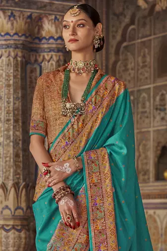 Turquoise silk blend printed saree with unstitched blouse piece