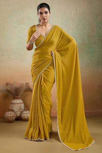 Mustard georgette embellished saree with unstitched blouse piece