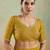 Mustard georgette embellished saree with unstitched blouse piece