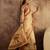 Beige silk cotton printed saree with unstitched blouse piece