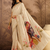 Cream cotton printed saree with unstitched blouse piece
