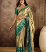 green silk blend blend zari saree with unstitched blouse piece