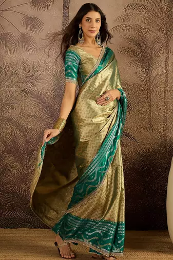 green silk blend blend zari saree with unstitched blouse piece
