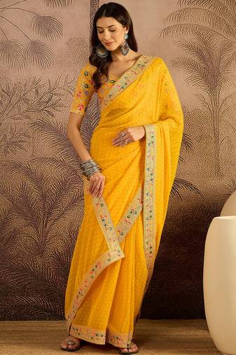 Georgette yellow bandhni saree with unstitched blouse piece