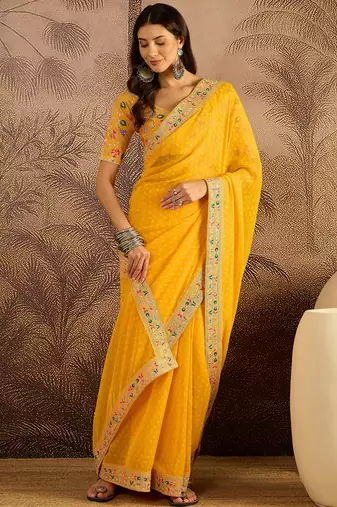 Georgette yellow bandhni saree with unstitched blouse piece