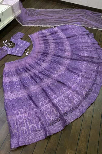 Lavender Embroidered Net Lehenga Choli.