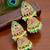 Gold plated kundan meenakari lime green jhumka earrings