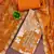 Orange cotton silk printed unstitched dress material