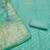 Turquoise shimmer banarasi embellished unstitched dress material