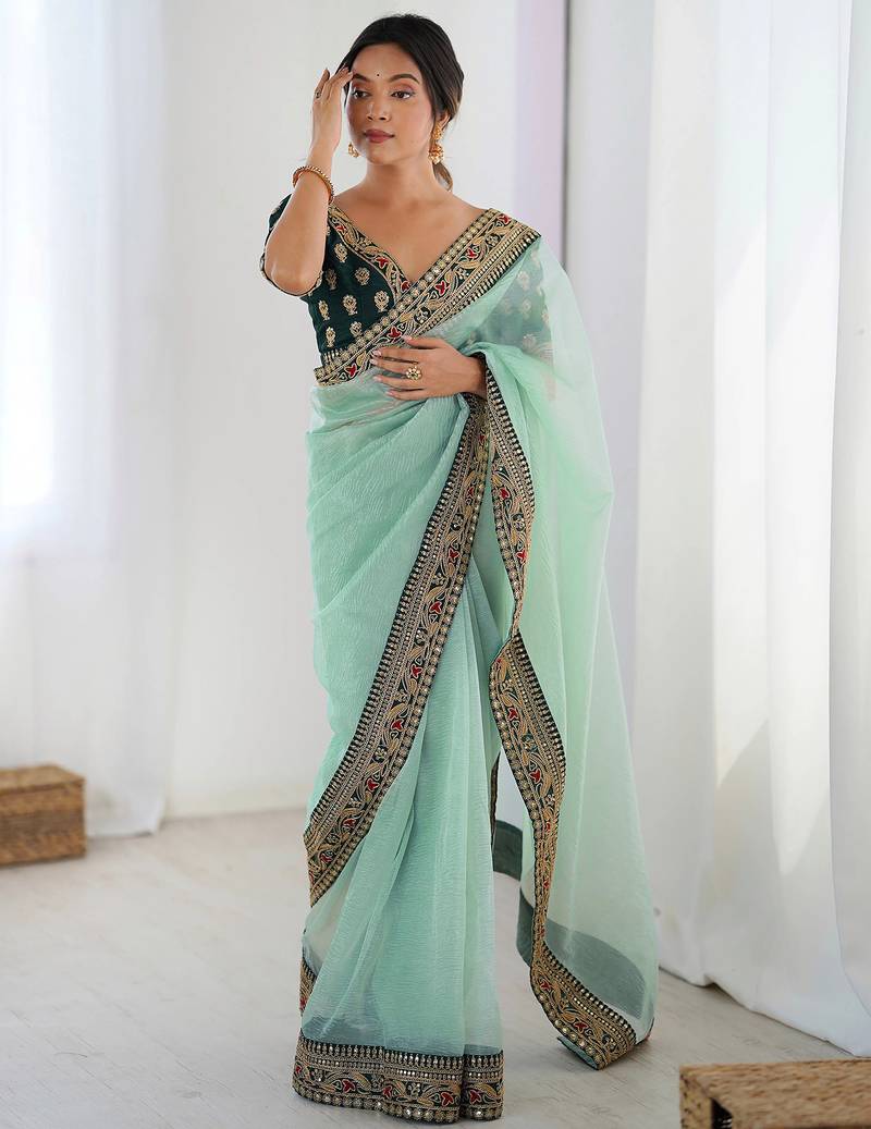 Women's shimmer net traditional motiff embroidered saree with blouse piece