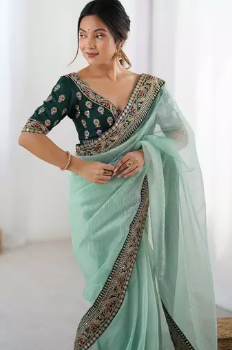 Women's shimmer net traditional motiff embroidered saree with blouse piece