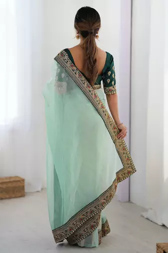 Women's shimmer net traditional motiff embroidered saree with blouse piece