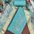 Turquoise cotton silk embroidered unstitched dress material