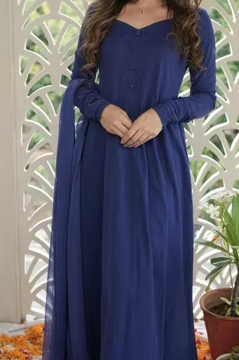 Its solid navy blue anarkali kurta with dupatta
