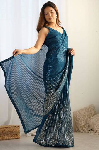 Teal sequin embroidered georgette saree