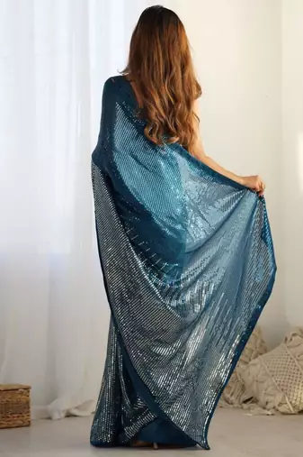 Teal sequin embroidered georgette saree
