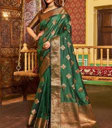 green silk blend banarasi saree with blouse 