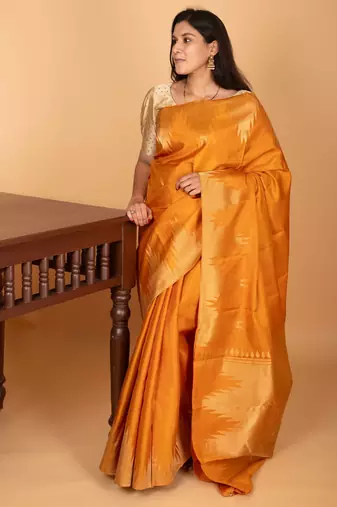 Turmeric yellow temple border pure kanchi silk saree