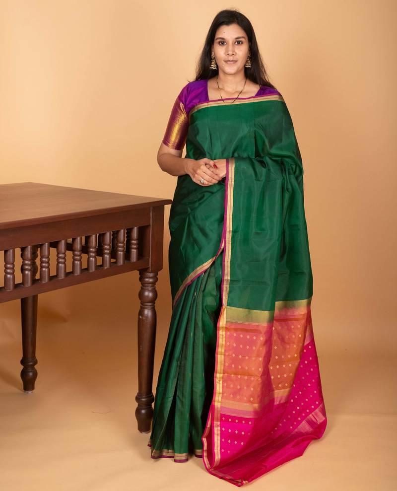 Bottle green and rani pink partly pleats pure kanjivaram silk saree