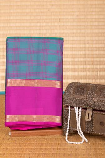 Peacock green and purple checked pure touch silk saree