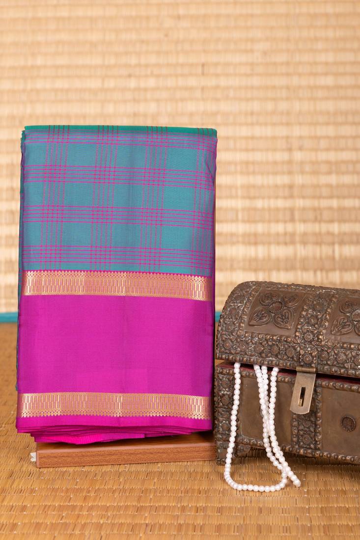 Peacock green and purple checked pure touch silk saree
