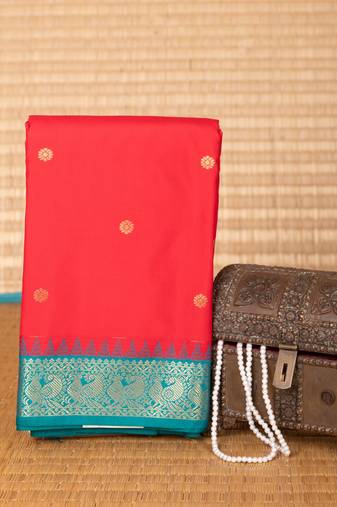 Milagai pazham and teal green small border semi silk saree