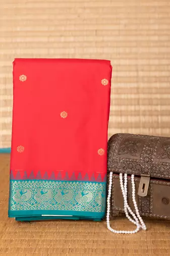 Milagai pazham and teal green small border semi silk saree