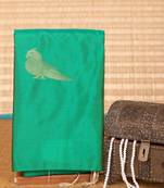 Emerald green and beige borderless soft silk saree