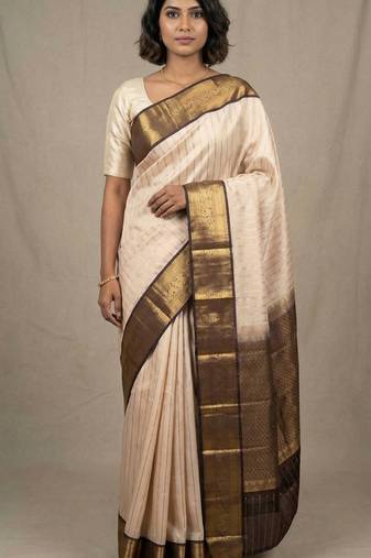Champagne pink and pakku striped pure touch silk saree