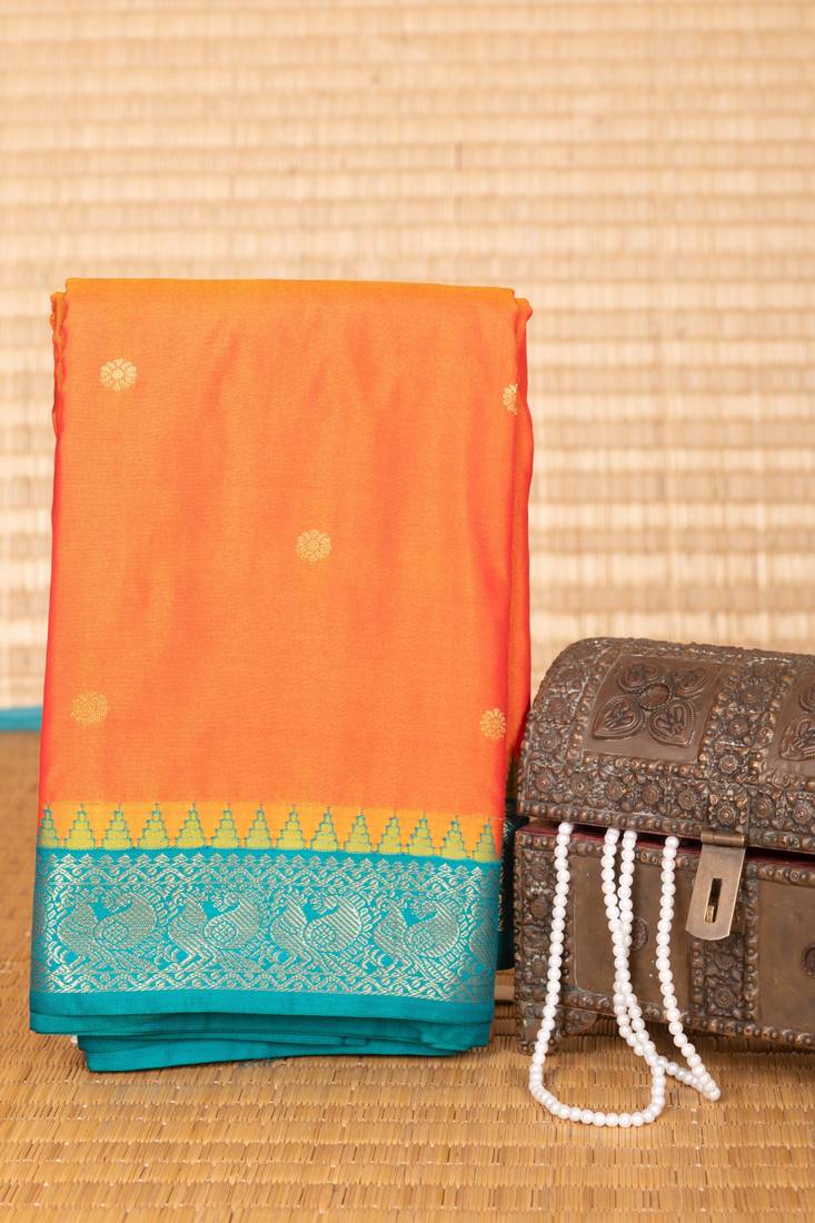 Dual tone orange and teal green small border semi silk saree