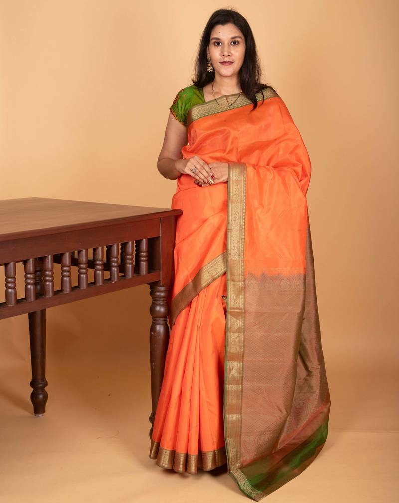 Coral orange and dual tone green zero zari pure kanchi silk saree