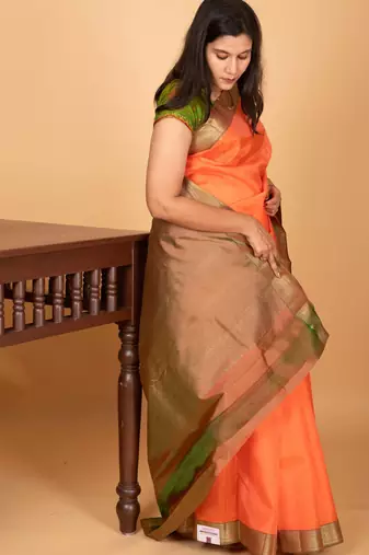 Coral orange and dual tone green zero zari pure kanchi silk saree