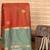 Rust orange and mint green semi silk saree