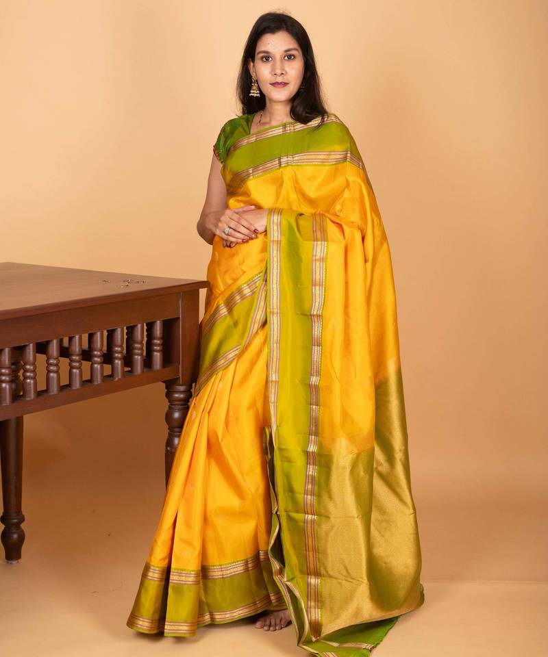 Royal yellow and dual tone green retta patta border pure kanchi silk saree