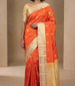 Persimmon orange and offwhite semi silk saree