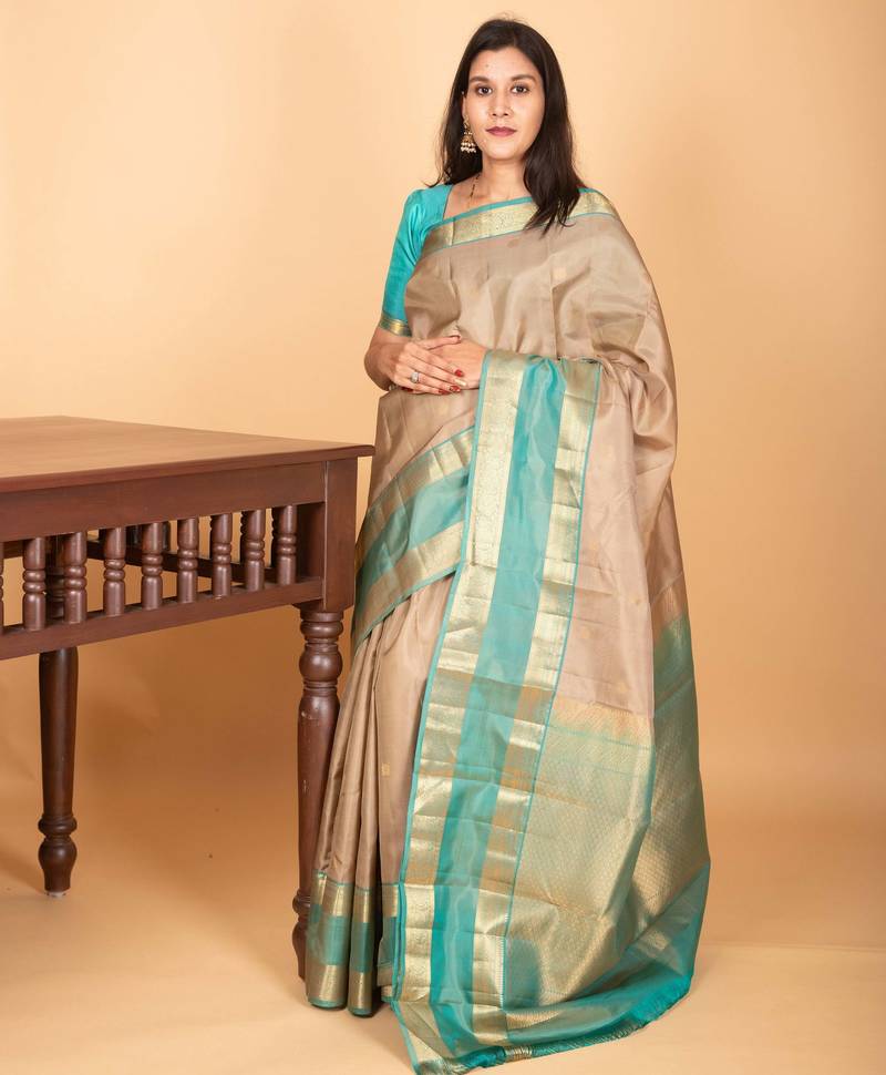 Oatmeal white and dual tone blue retta patta border pure kanchi silk saree