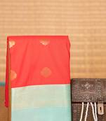 Red orange and pastel blue semi silk saree