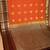Pumpkin orange and chocolate brown semi silk saree