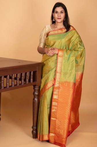 Dual tone green and dual tone orange small border kanchi pure silk saree