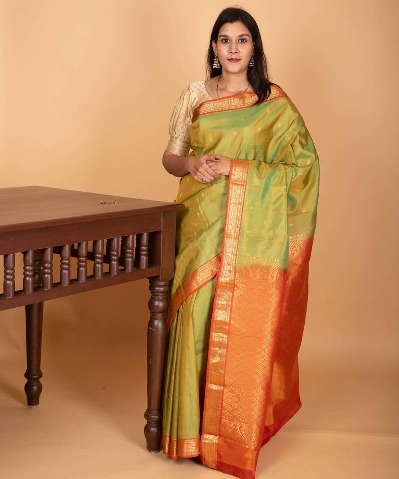 Dual tone green and dual tone orange small border kanchi pure silk saree