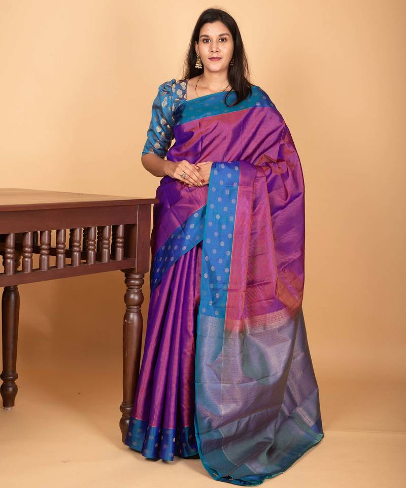 Dual tone purple and peacock blue zari striped pure kanchi silk saree