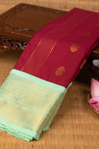 Dark red and pastel green semi silk saree with blouse