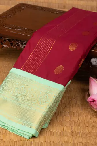 Dark red and pastel green semi silk saree