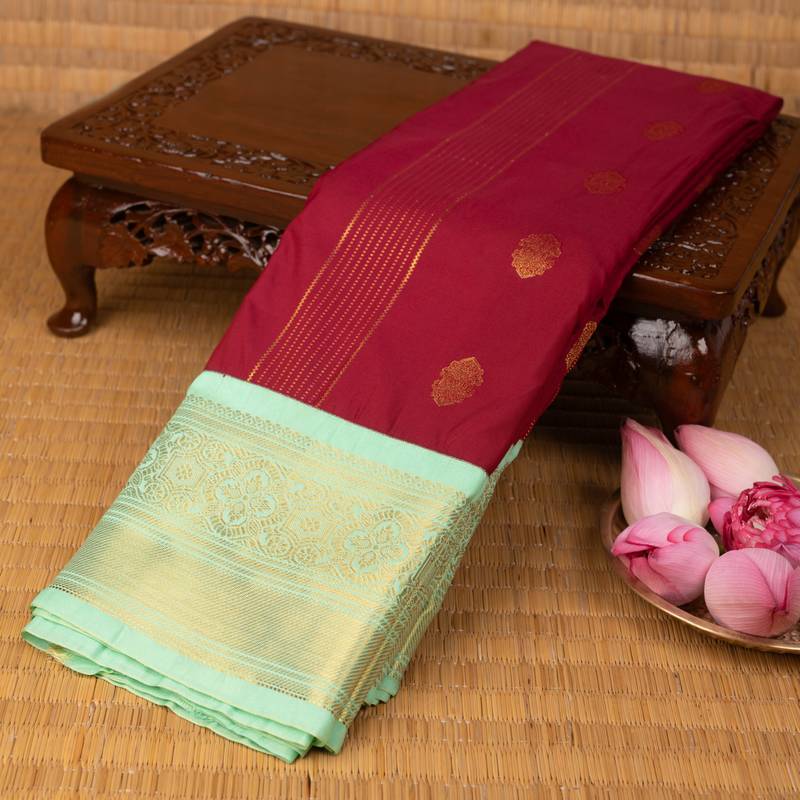Dark red and pastel green semi silk saree