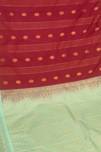 Dark red and pastel green semi silk saree