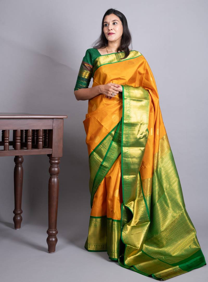 Turmeric yellow and forest green pure kanjivaram silk saree