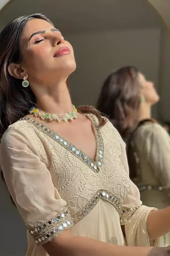 Cream mirror-work georgette Gown.