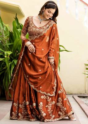 Appealing Rust Orange Zari and Sequins and Thread Embroidered Rangoli silk Indian wedding Designer lehenga choli 1