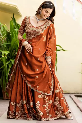 Appealing Rust Orange Zari and Sequins, and Thread Embroidered Rangoli silk Indian wedding Designer lehenga choli