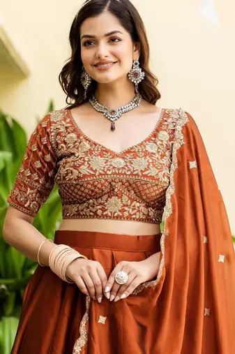Appealing Rust Orange Zari and Sequins, and Thread Embroidered Rangoli silk Indian wedding Designer lehenga choli